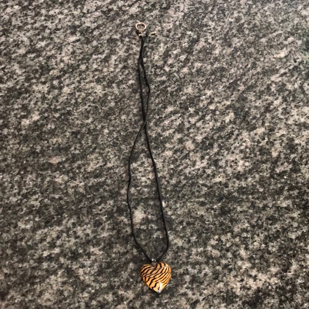 Tiger stripe glass heart pendant on silk cord with silver clasp